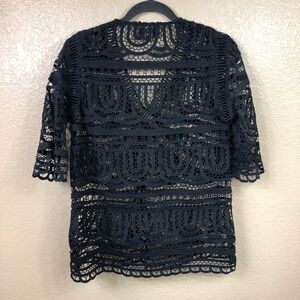 Goldie crocheted lace v neck flare sleeve top.